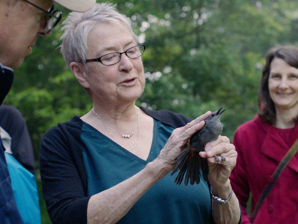 Ellen Ketterson holding a bird and teaching